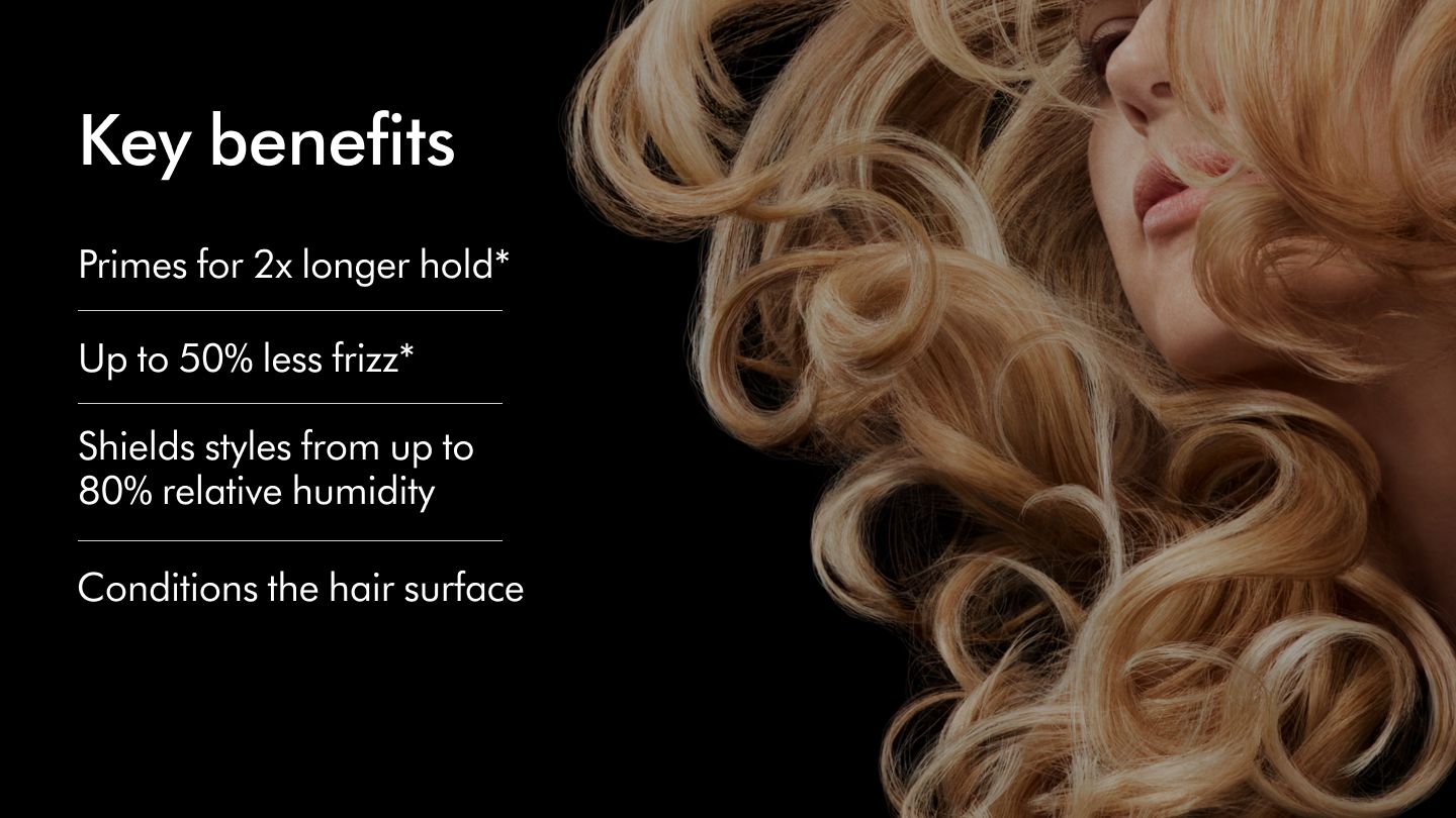 A blonde model with voluminous wavy hair styled with Dyson Chitosan key benefits
